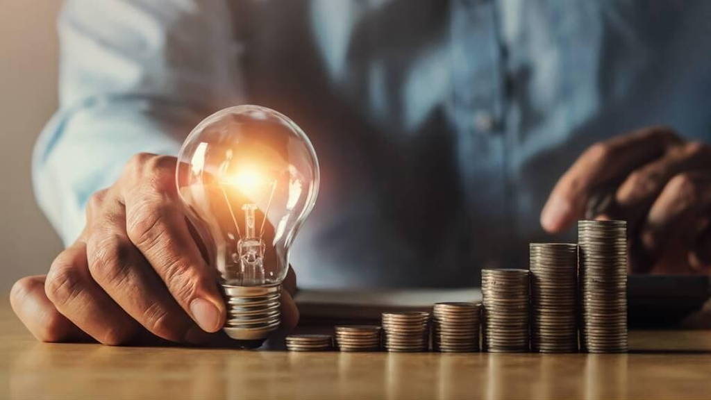 businessman hand holding light bulb. idea concept with innovatio