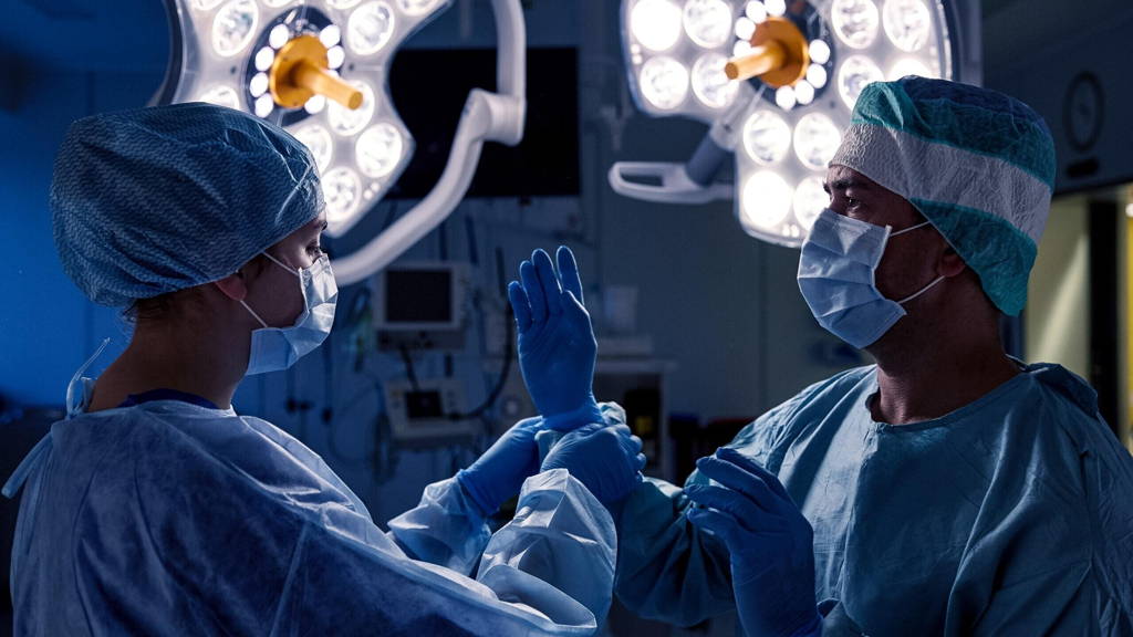 surgeons in operating room at hospital