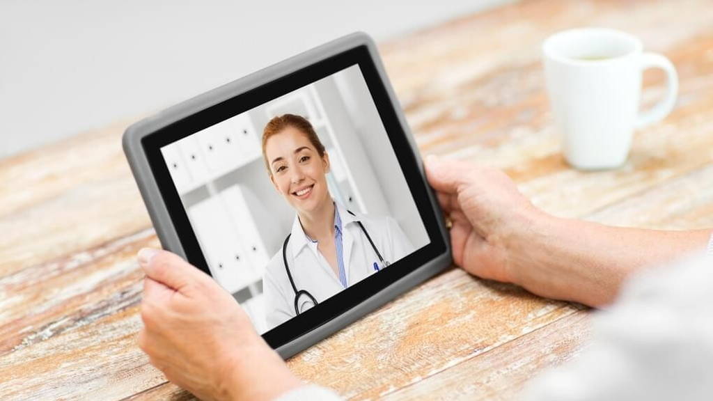 senior woman patient having video call with doctor