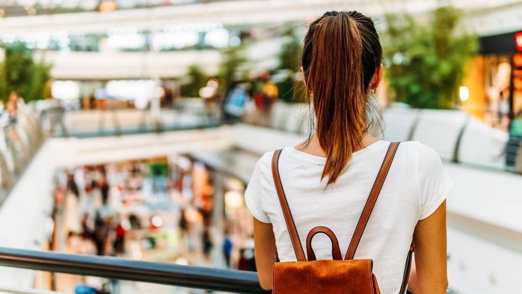 Young Woman Exploring Modern Shopping Mall