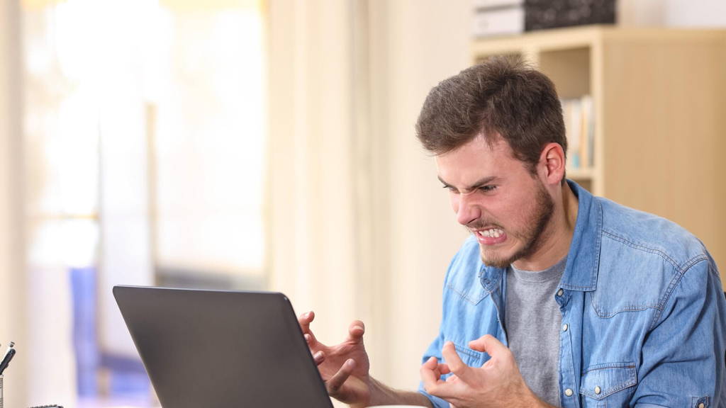 Entrepreneur angry and furious with laptop