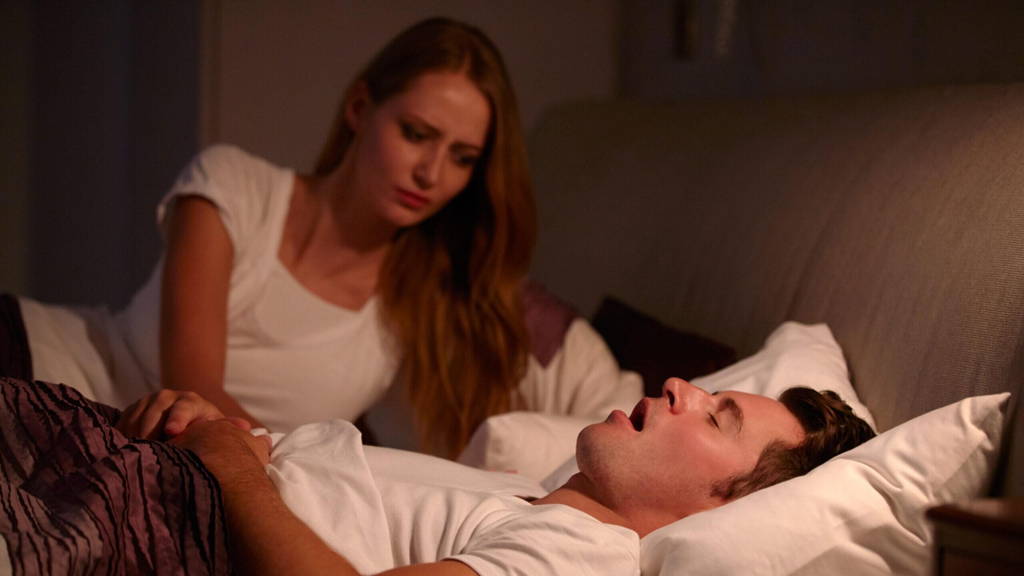 Woman Disturbed By Man's Snoring As They Lie In Bed