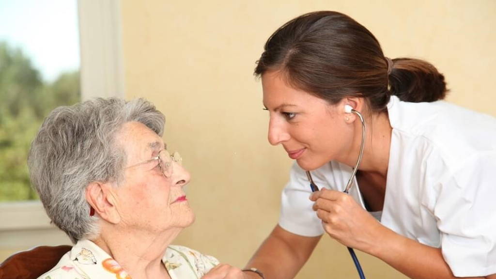 Elderly person with nurse