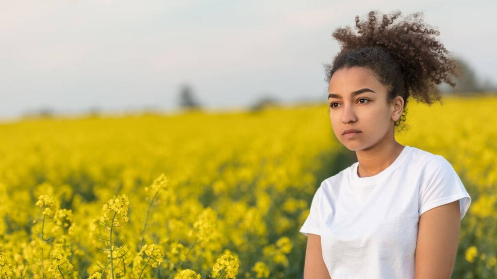 Sad Mixed Race African American Teenager Woman in Yellow Flowers